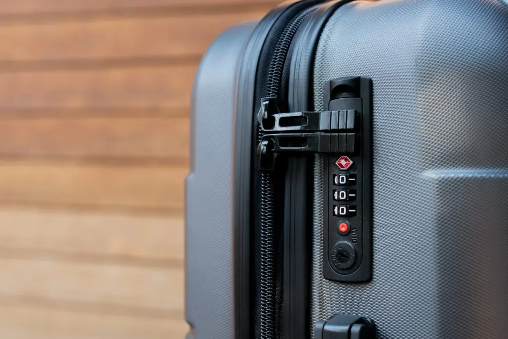 Travel Sentry | What Do You Have to Remove at Airport Security? Travel Sentry TSA lock securing a checked suitcase