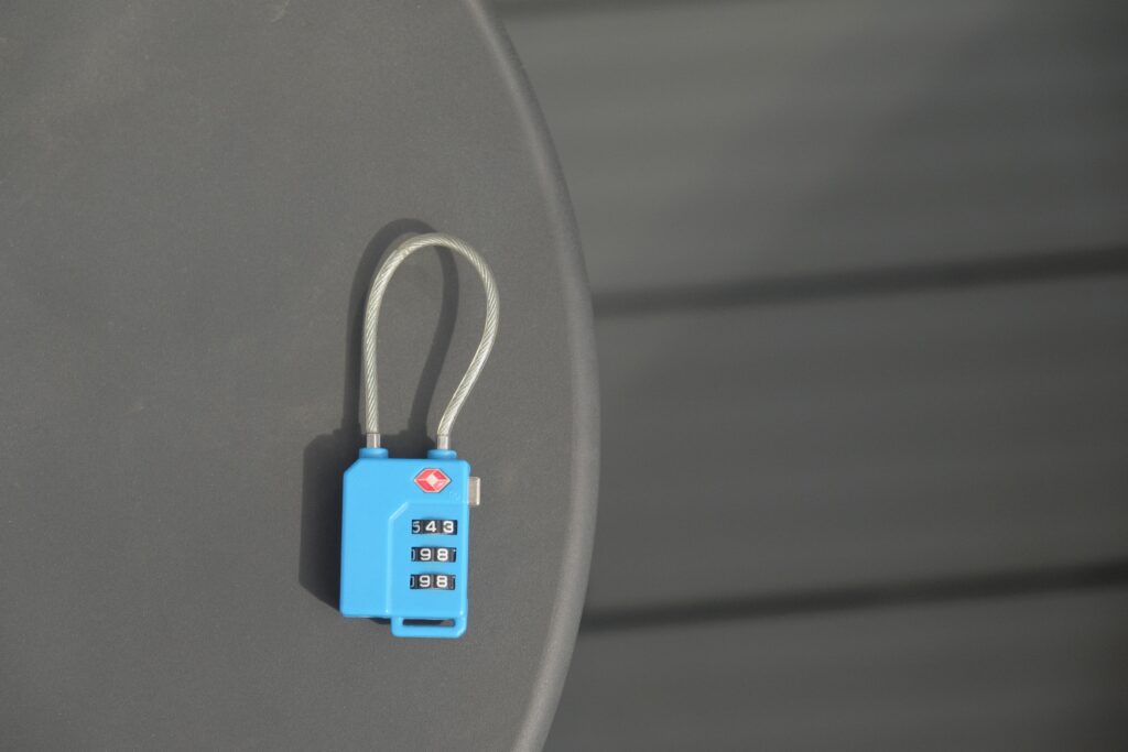 Travel Sentry | Should You Receive a Key with a TSA Lock? TSA lock on black background